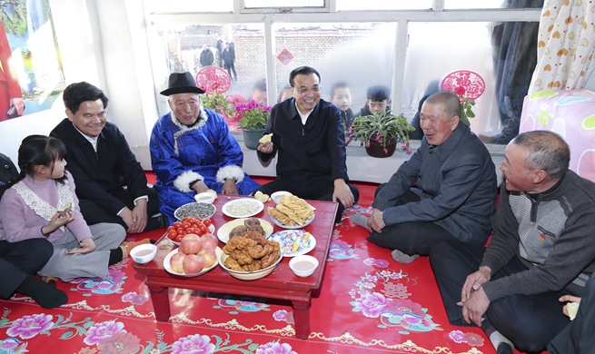 Premier Li calls for efforts to improve people's wellbeing