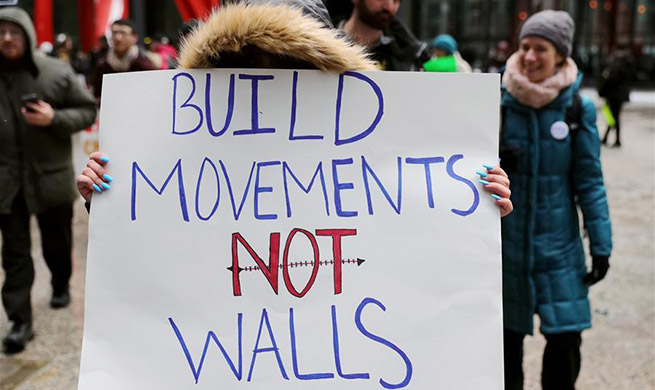 People protest against Trump's national emergency declaration in Chicago