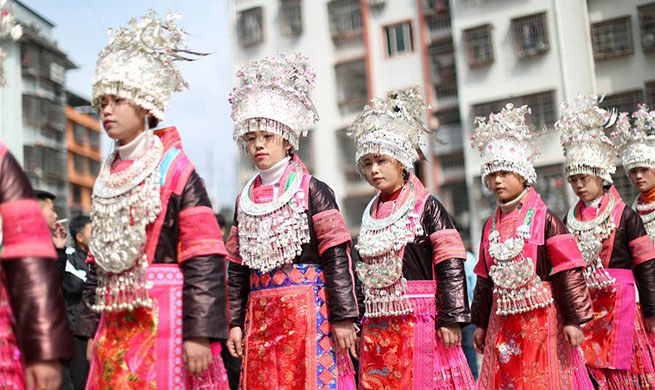 Miao people dance to Lusheng to celebrate new life in SW China's Guizhou