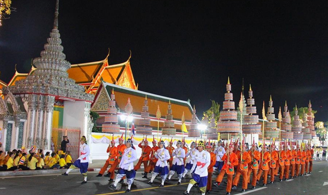 Thai monarch takes grandiose procession in Bangkok's olden quarters