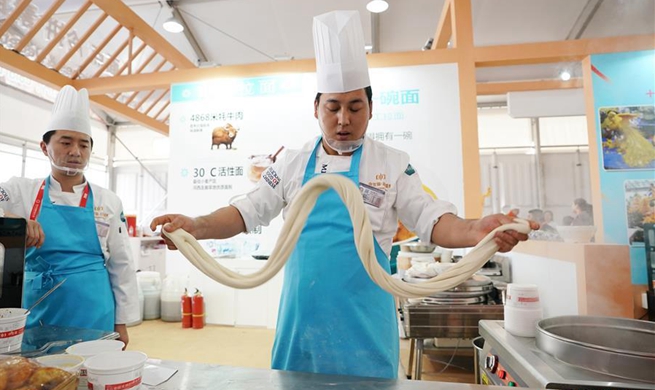 Cooks make delicious food during Asian Cuisine Festival in Beijing