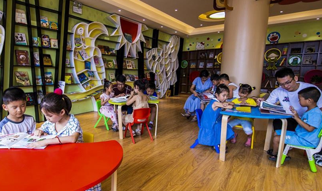 Children spend spare time in book stores during summer vocation