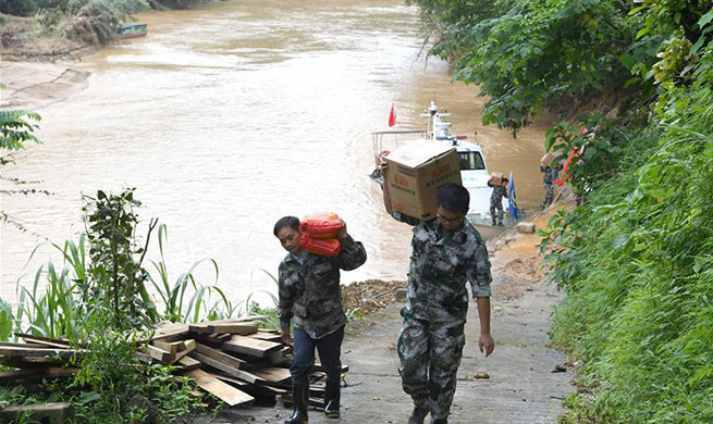 Villagers in flood-affected Guangxi receive disaster relief materials
