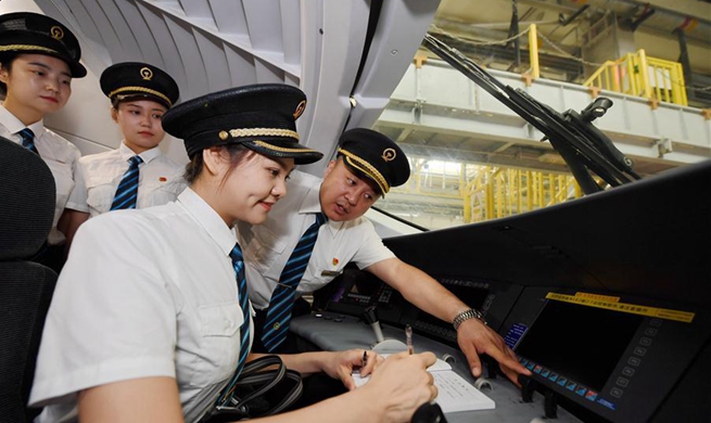 Trainees attend courses to become 1st batch of female bullet train drivers in China