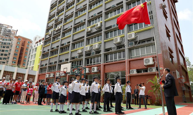 Association of Hong Kong Flag-guards holds flag raising ceremony at middle school