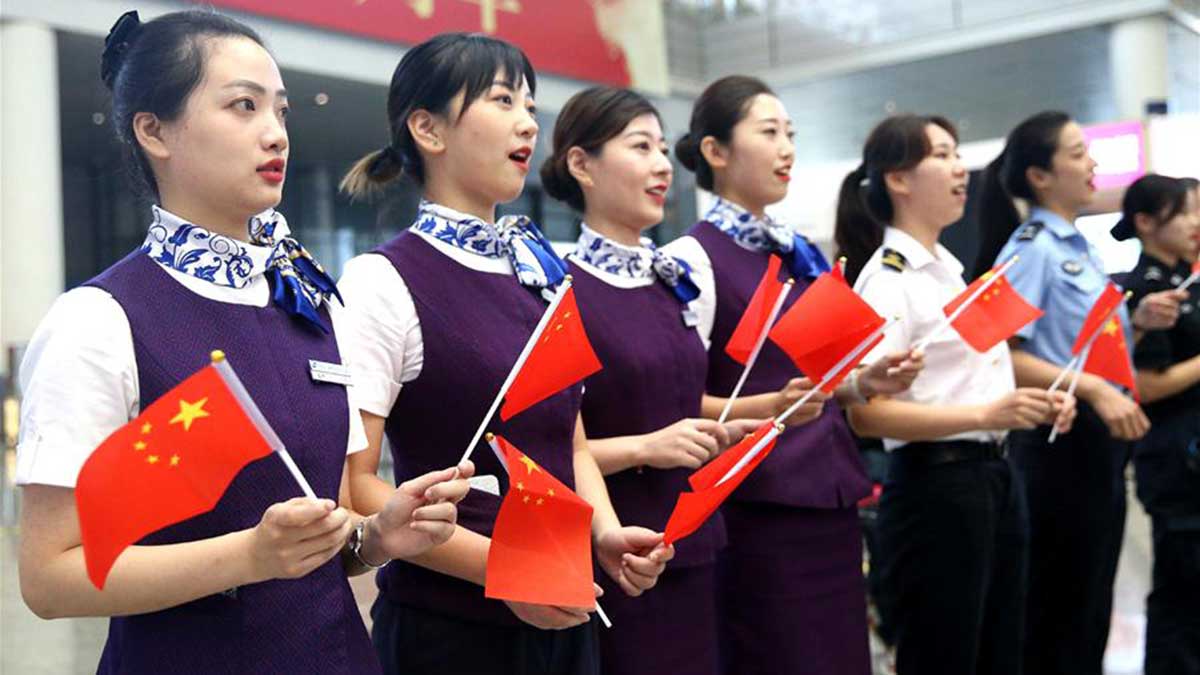 People take part in flash mob in Shanghai to celebrate 70th anniversary of PRC founding