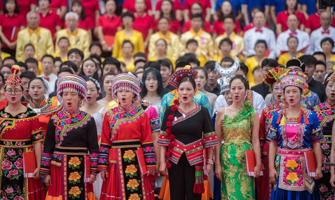 People take part in chorus performance to celebrate upcoming National Day