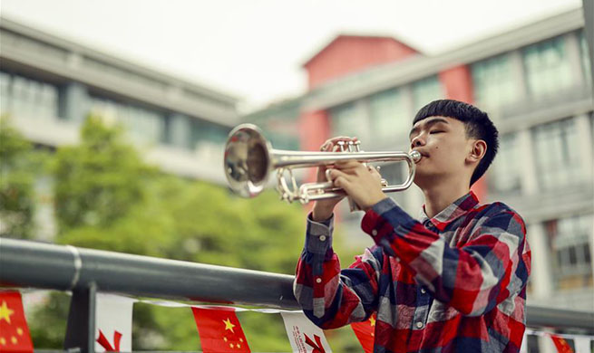 Pic story: visually impaired boy pursues dream of music in China's Chongqing