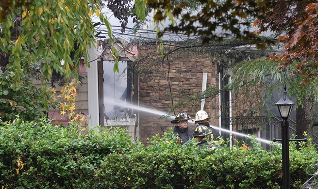 Small plane crashes into New Jersey residential area, pilot dead