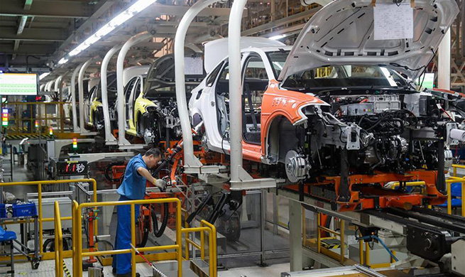 Staff members work at production line of SAIC Volkswagen in Shanghai