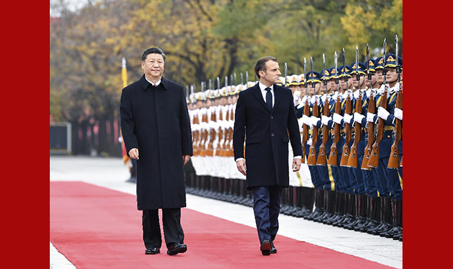 Xi holds talks with Macron in Beijing