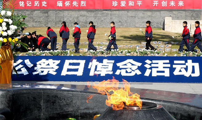 Memorial ceremony held in Shanghai on China's National Memorial Day for Nanjing Massacre Victims