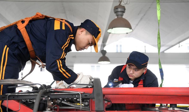 Railway workers conduct maintenance checks for upcoming Spring Festival travel rush