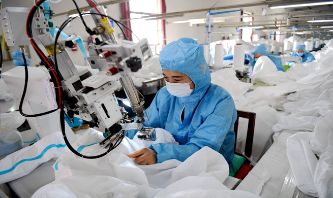 Companies in China busy producing medical materials for coronavirus control