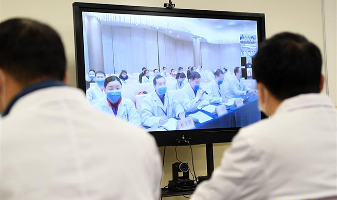 Medical experts in Chongqing cooperate with frontline medical workers to aid novel coronavirus control efforts in Wuhan