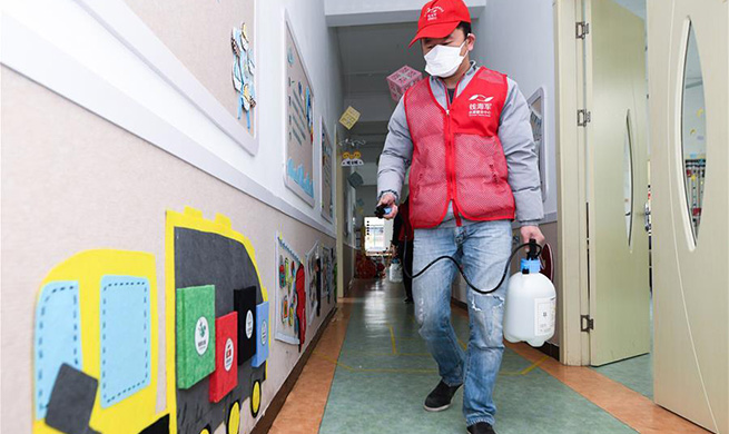 Volunteers conduct disinfection at kindergarten in Zhejiang