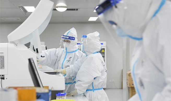 Pic story of medical staff conducting detections at Leishenshan Hospital