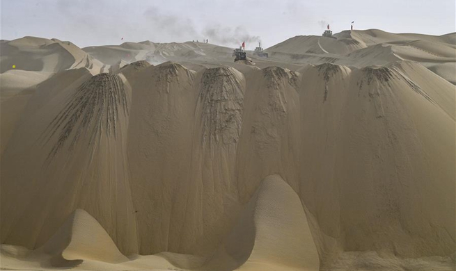 Construction of highway running through Taklimakan Desert enters final rush in NW China's Xinjiang