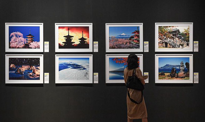 World cultural heritage photography art exhibition opens in Hainan