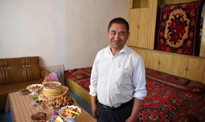 Across China: Villagers relish modern life in new houses in Xinjiang