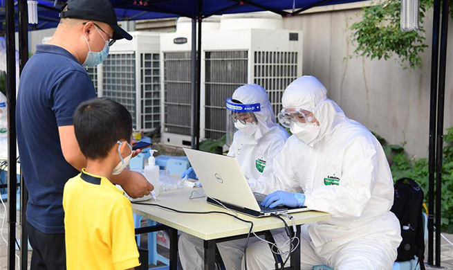 Communities in Beijing take strict measures to prevent spread of COVID-19 pandemic