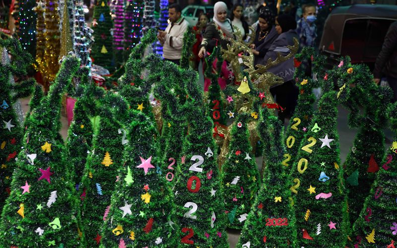 People shop for Christmas decorations in Cairo