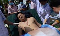 Injured people receive medical treatment after earthquake