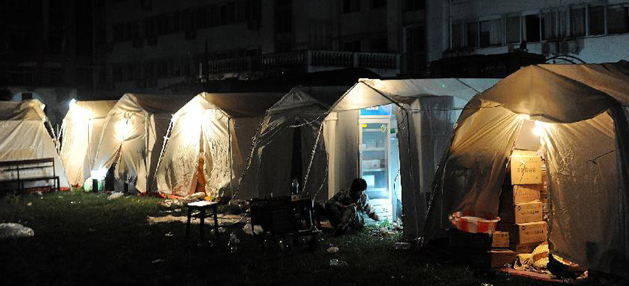 Workers & voluteers from Red Cross Society conduct relief work in quake-hit region