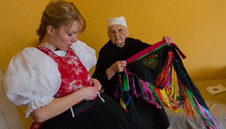 Hungary's Holloko celebrates Easter with "watering of girls"