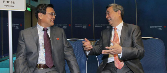 Xinhua president talks with KCNA director general at media summit