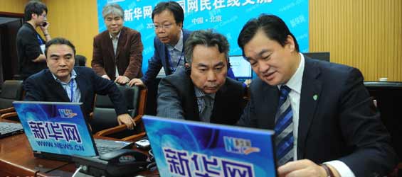 Xinhua reporters cover online interview of Russian PM