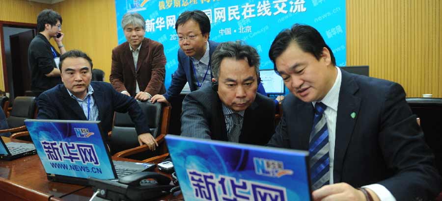 Xinhua reporters cover online interview of Russian PM