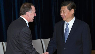 China, New Zealand pledge to further ties, cooperation