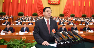 China's top legislator delivers NPC Standing Committee work report