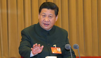 Xi vows no compromise on national interests