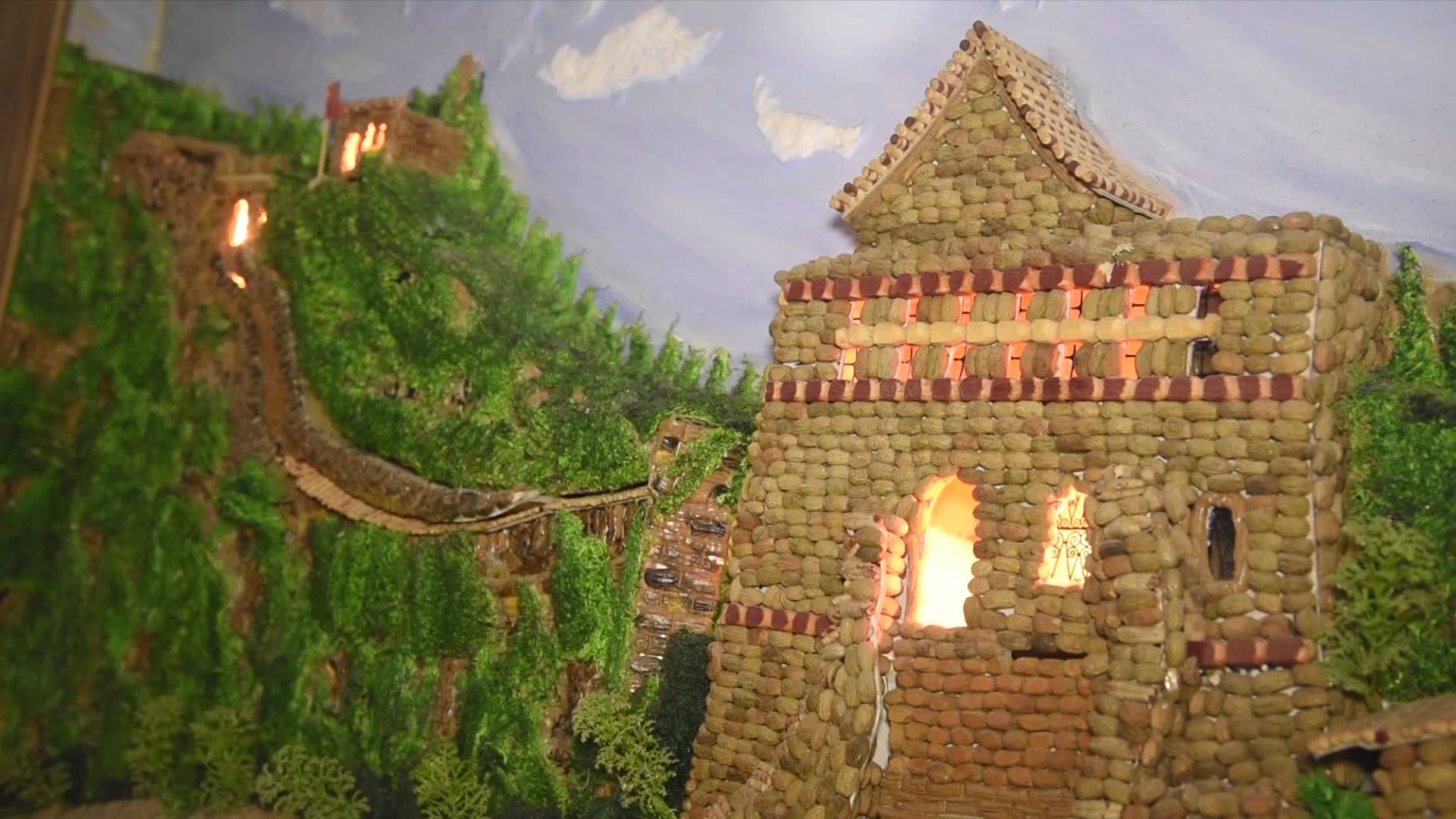 GLOBALink | Syrian artist uses olive pits to create 3D painting of Great Wall