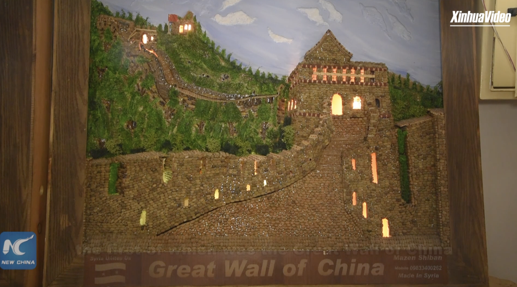 Syrian artist aspires to internationalism by creating China's Great Wall from olive kernels