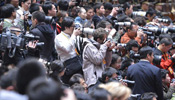 Journalists cover closing session of 18th CPC National Congress