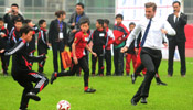 David Beckham plays football with young players in Wuhan