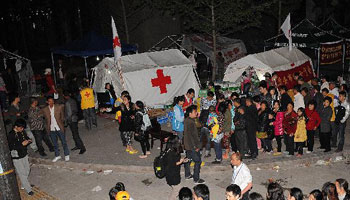 Workers & voluteers from Red Cross Society conduct relief work in quake-hit region