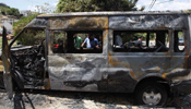 Burnt vehicles seen in Umm al-Qutuf,Israel