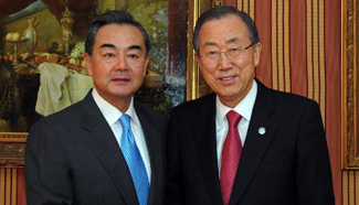 Chinese FM meets UN chief in Montreux, Switzerland