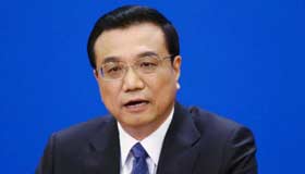 Premier Li: China will deepen reforms, curb risks