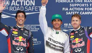 Hamilton celebrates after qualifying session at F1 Chinese Grand Prix
