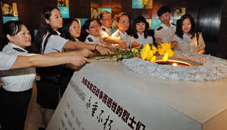 People mourn martyrs at Changchun Museum to mark start of anti-Japan war