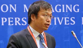 Professor Gan Li gives keynote speech at the Global Forum on Managing Economic Transition