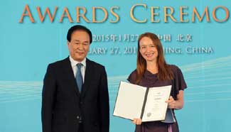 Xinhua News Agency president presents award to news team