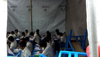 Nepalese students take monthly exam in tents