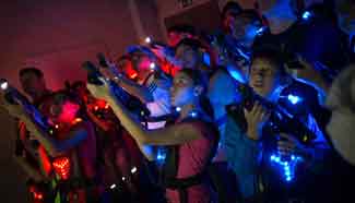 Visitors have fun in "Ghostbusters" attraction of Mexican park