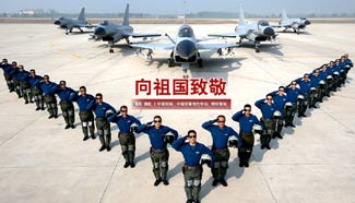 Chinese soldiers greet Motherland's 66th birthday